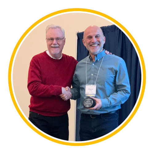 Image of Marco Molinaro holding award